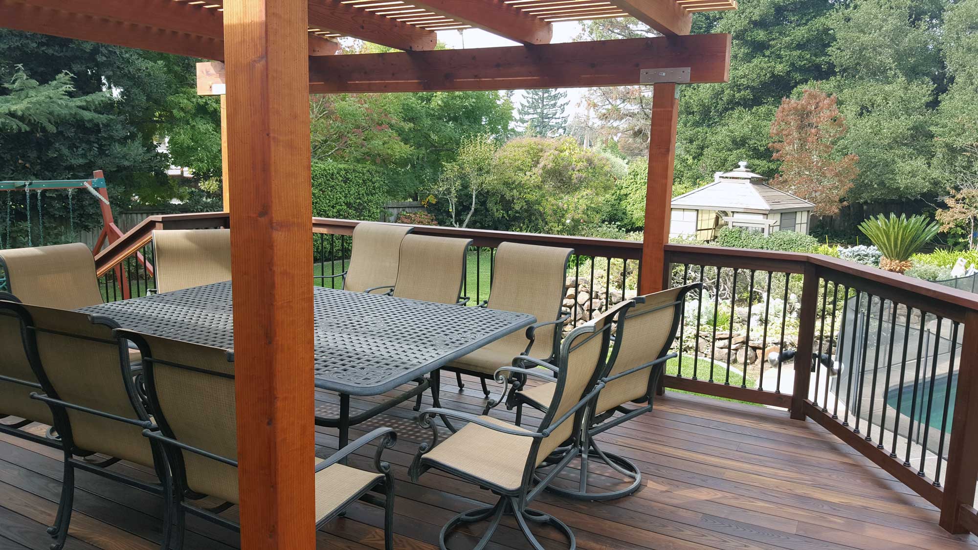 Americana deck with cedar patio cover. Rail is Americana with Titan SnapNLock aluminum balusters