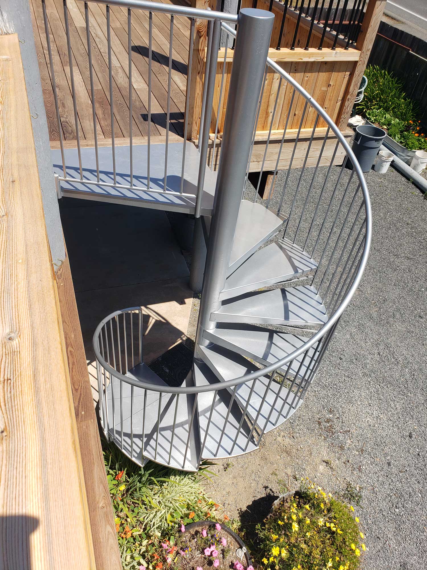 Americana deck with custom rail for partial privacy and spiral staircase in Bodega Bay, CA