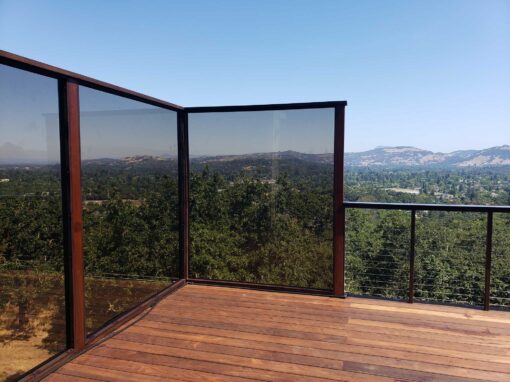 Double decker Americana deck with stainless steel cable rail, tempered glass windscreen and ZipUp ceiling for waterproof lower deck in Santa Rosa, CA